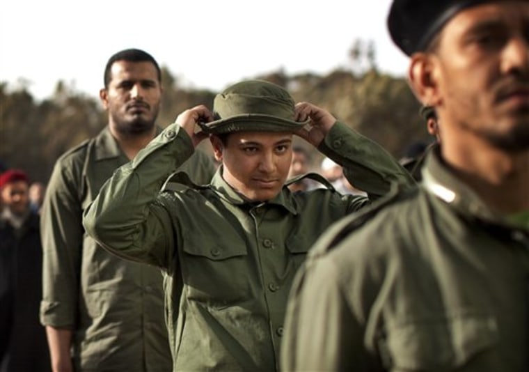 Libyan rebel recruits stand in formation during a training session in Benghazi on March 1.
